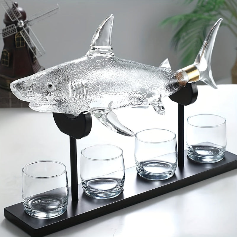 Discover the elegance of our Shark Shaped Wine Decanter, hand blown from high-quality glass. Perfect for wine enthusiasts and a great gift idea.